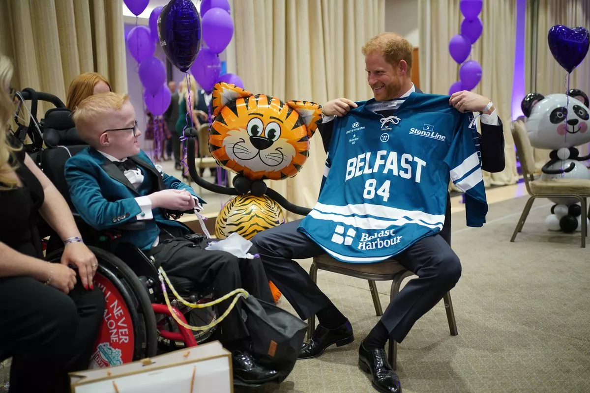 Prince Harry is given an ice hockey shirt by Blake McCaughey during the annual WellChild Awards 2023 at the Hurlingham Club in London. Picture date: Thursday September 7, 2023.