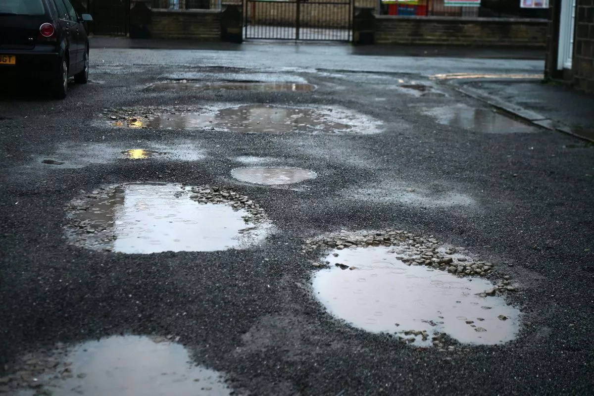 Potholes on a road in Bingley, Yorkshire