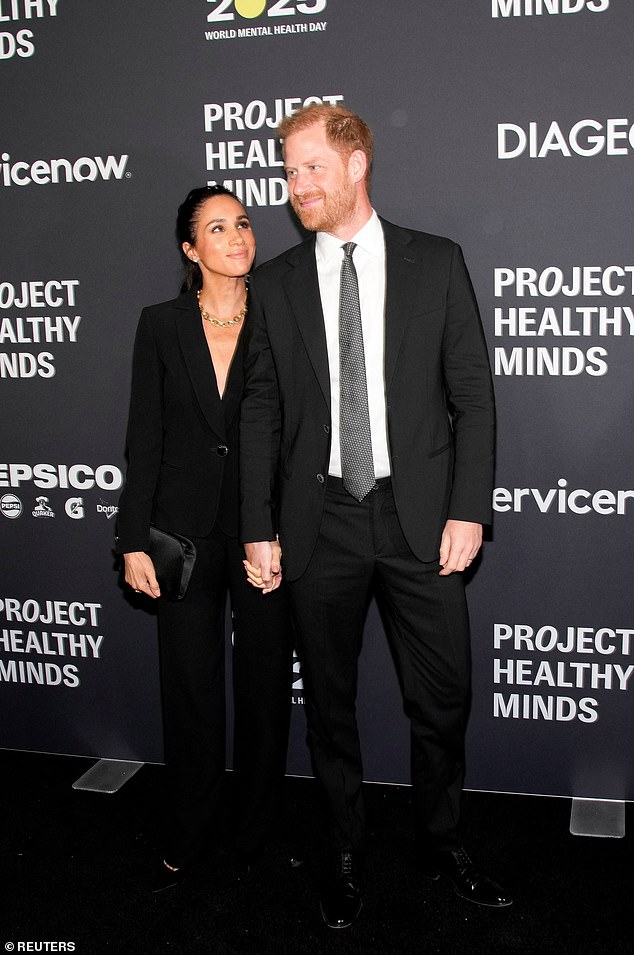 Prince Harry and Meghan before getting their Humanitarians of the Year award in New York on October 9
