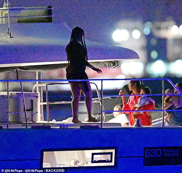 They remained on the boat until dusk, allowing them to take in a glistening orange sunset