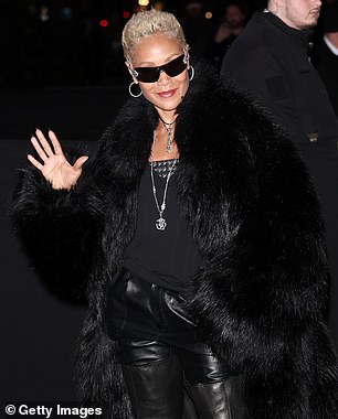 Pinkett color-coordinated with the actor by wearing a pair of black leather pants as well as a shirt with silver-studded details at the top