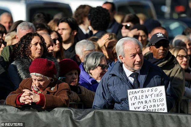People gathered on the street outside ahead of the ceremony