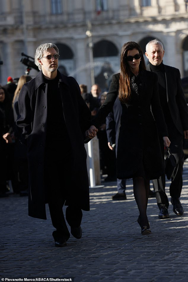 Anne, 43, who first met Valentino on the set of her hit film The Devil Wears Prada, was supported by her husband Adam Shulman