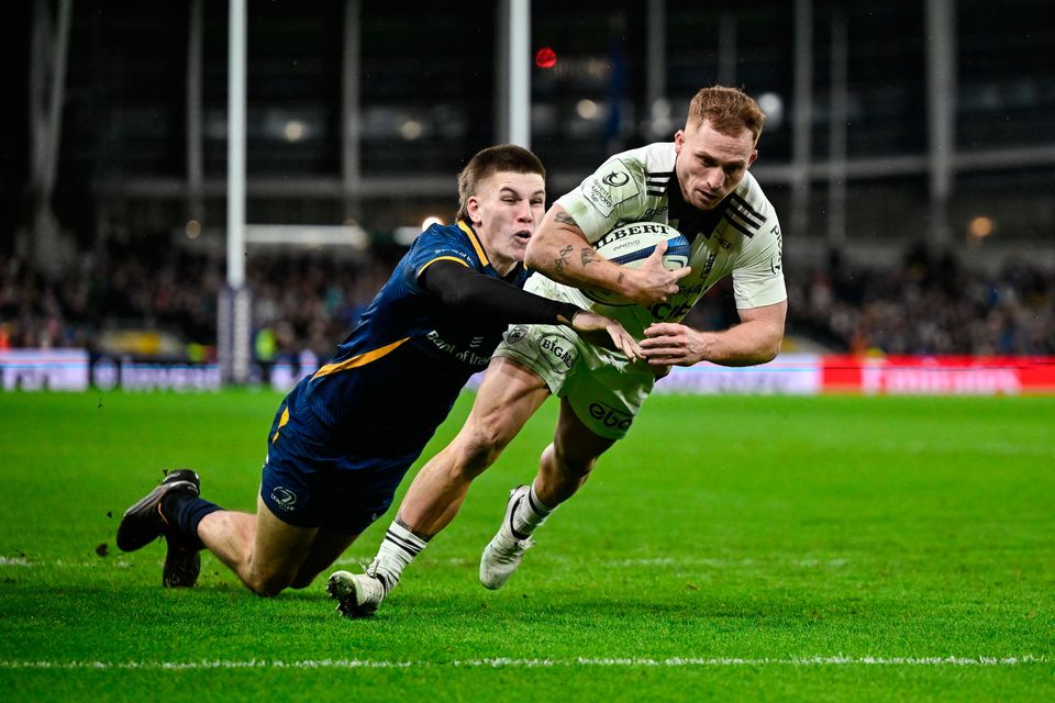 Ihaia West of La Rochelle scores his side's third try despite the tackle of Sam Prendergast at the Aviva Stadium on Saturday night. Photo: David Fitzgerald/Sportsfile