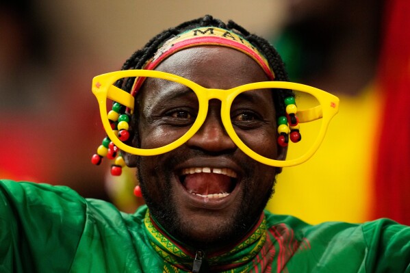 A Mali soccer fan waits for the start of the African Cup of Nations Group A soccer match with Morocco in Rabat, Dec. 26, 2025. (AP Photo/Mosa'ab Elshamy, File)