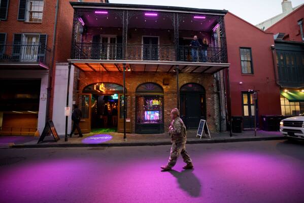 The Louisiana National Guard, military police, and Louisiana law enforcement patrol the French Quarter as part of a National Guard deployment for New Year's celebrations in New Orleans, Dec. 30, 2025. (AP Photo/Matthew Hinton, File)