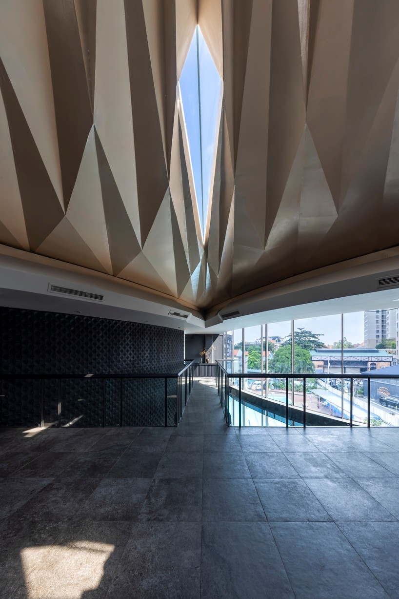 luminous origami-inspired steel roof by takashi niwa ornaments restaurant in vietnam