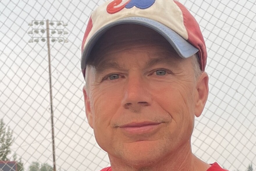 A man wearing a baseball cap