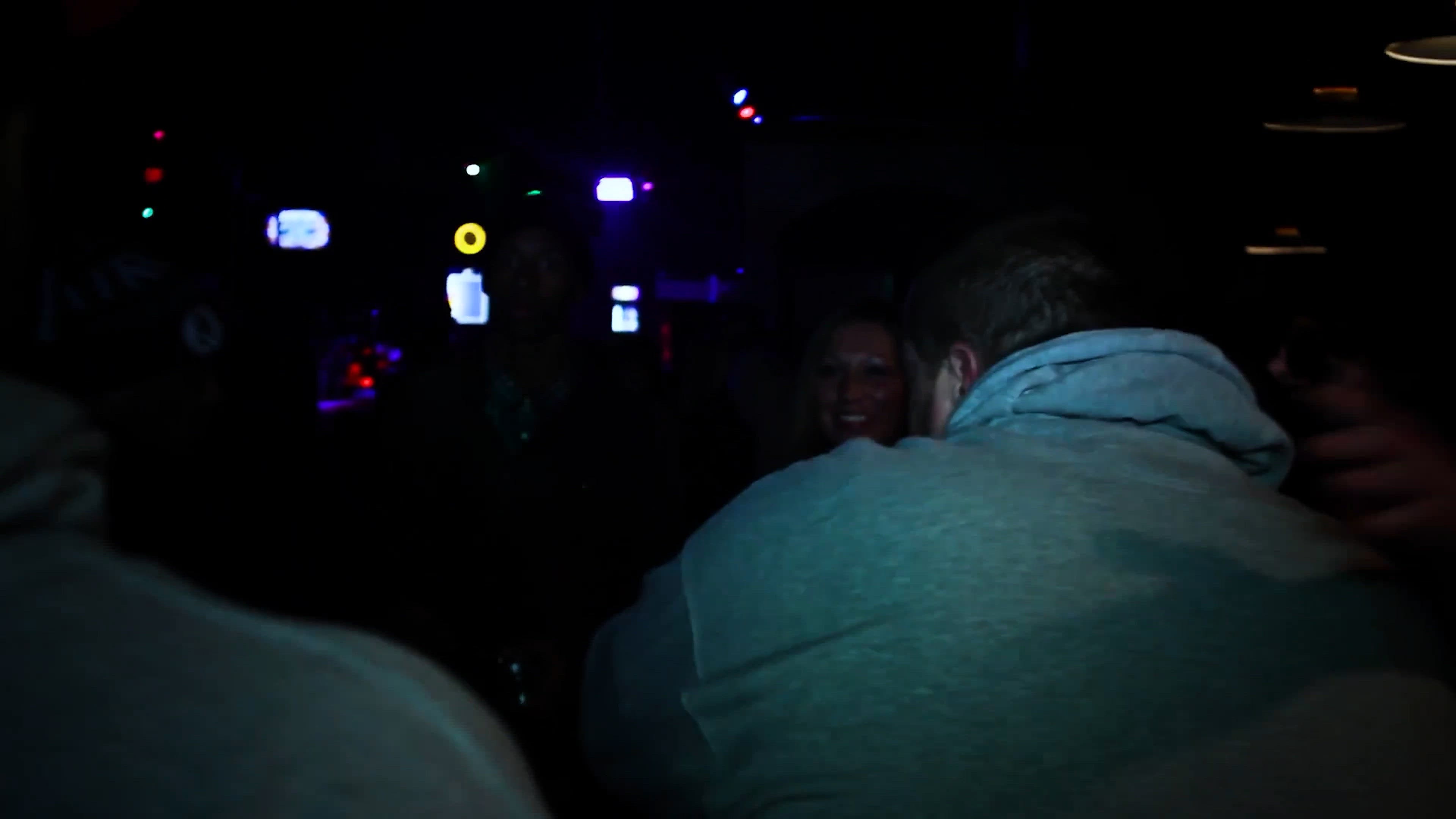 person flexing muscles outdoors