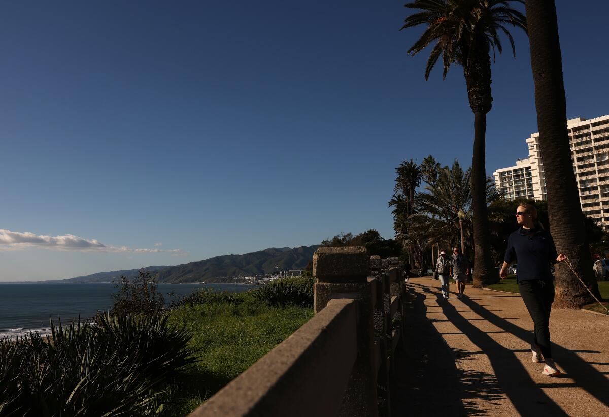 Pedestrians along the walking path on Ocean Boulevard.