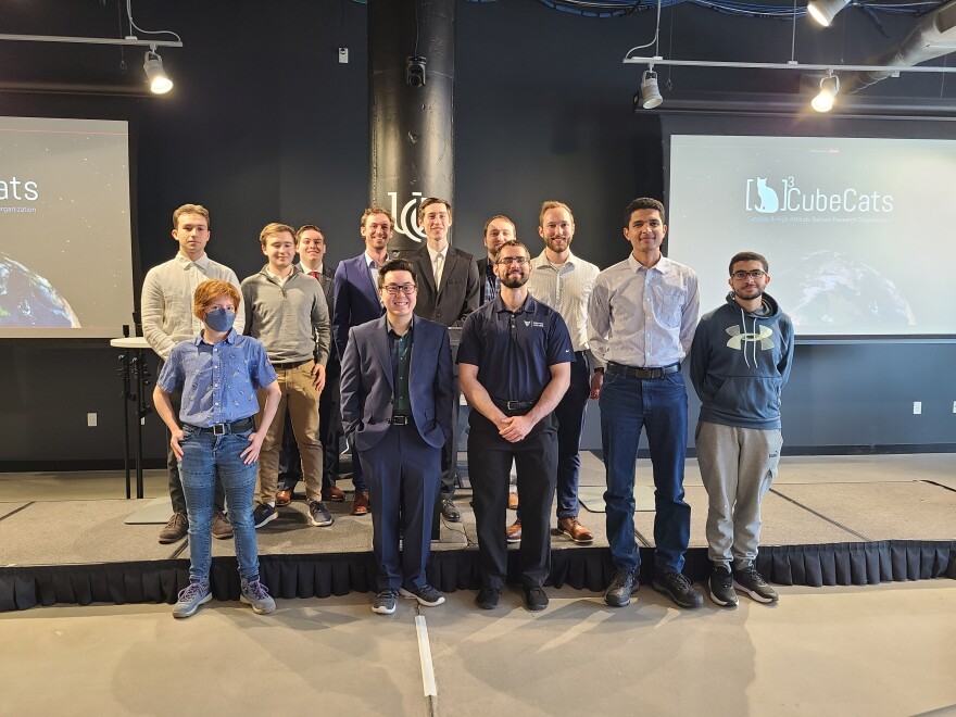 people pose for a photo