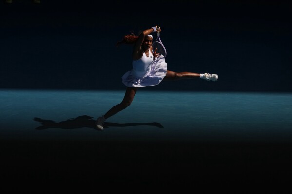 Coco Gauff of the U.S. plays a forehand return to Karolina Muchova of the Czech Republic during their fourth round match at the Australian Open tennis championship in Melbourne, Australia, Sunday, Jan. 25, 2026. (AP Photo/Asanka Brendon Ratnayake, File)