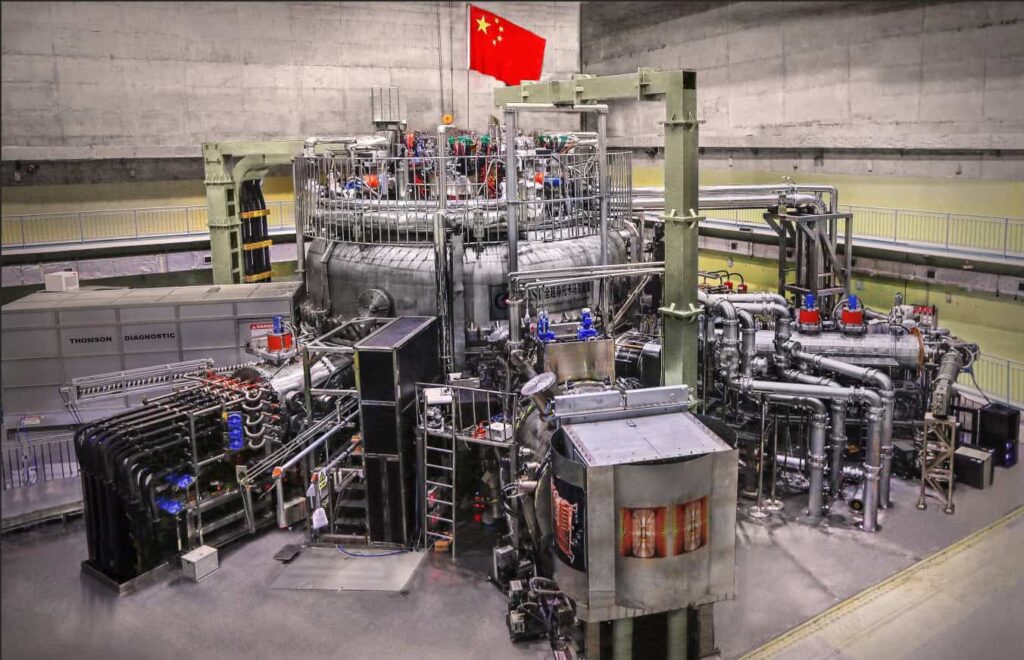Nuclear fusion reactor inside a facility with Chinese flag, advanced energy research facility.