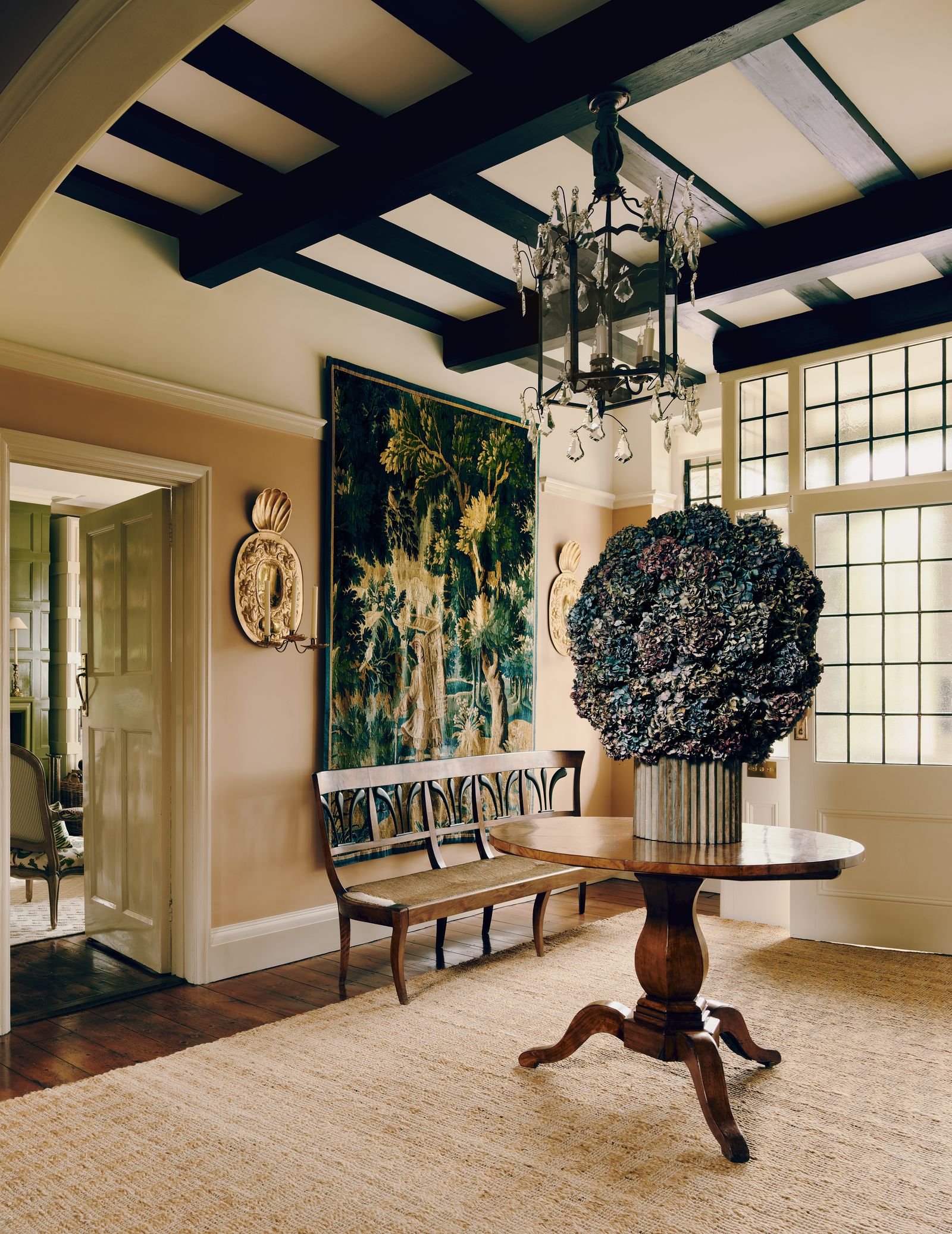 Image may contain Chandelier Lamp Home Decor Furniture Table Dining Table Indoors Architecture and Building