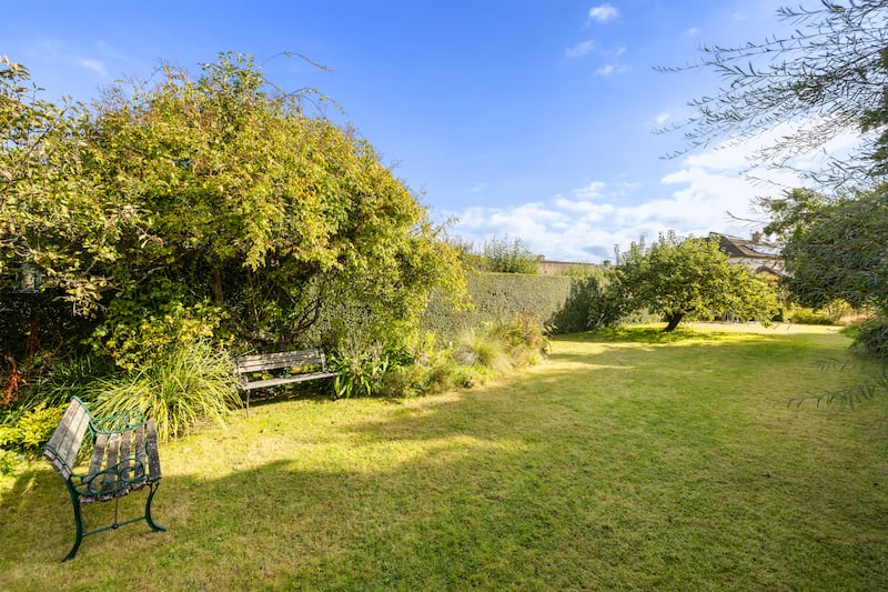 The long back garden is mainly in lawn