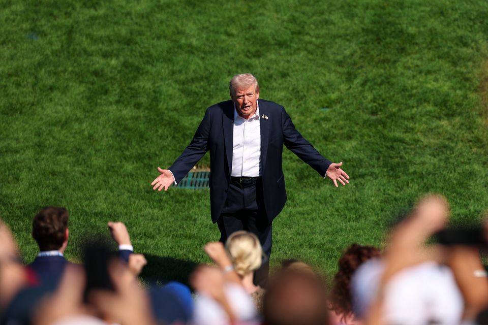 US president Donald Trump greets spectators by the first hole tee box at 2025 Ryder Cup last September. Photo: Getty