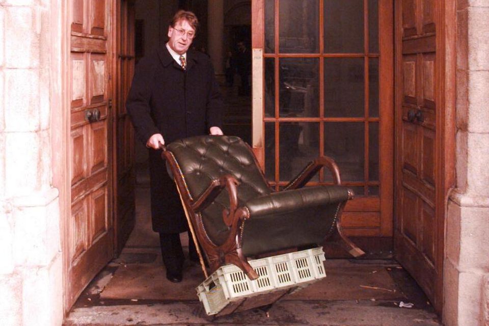 Tony McMahon, owner of Johnny Fox's, at the High Court with the restored library chair. Photo: Gerry Mooney