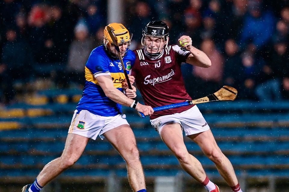 Galway's Darragh Neary tackled by Conor Stakelum of Tipperary during the Allianz Hurling League Division 1A match at Semple Stadium. Photo: Ben McShane/Sportsfile