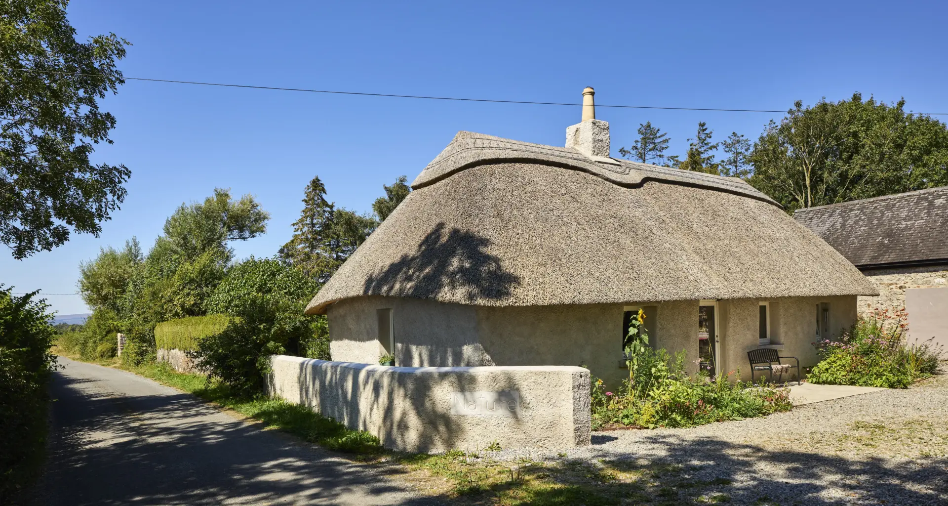 An architect has gently restored her thatched Tipperary cottage to improve flow