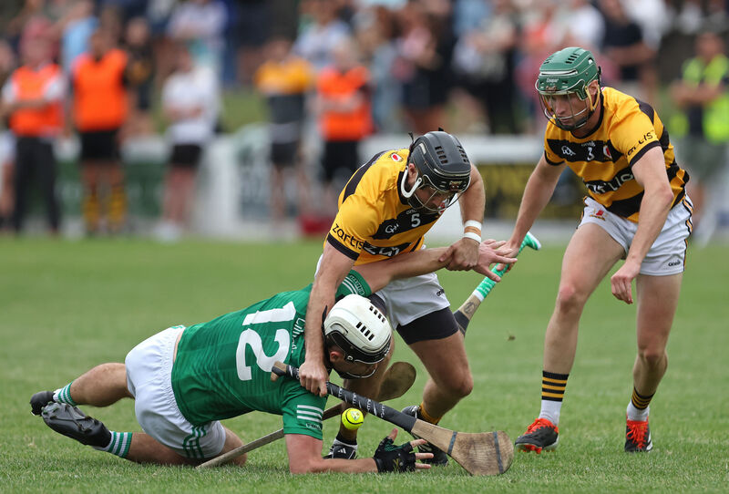  Keith Buckley and Ciaran Flynn, Na Piarsaigh, try to stop Barry Walsh, Killeagh during thier Senior A Hurling Championship match at Midleton.