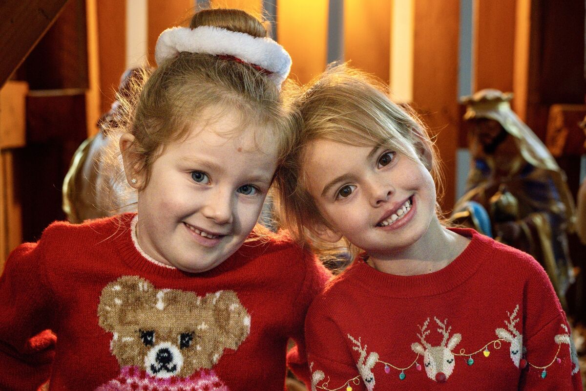 Ellie Young and Aoibheann Dunlea in front of the crib during the Christmas dinner celebrations at Scoil Maria Assumpta n Ballyphehane.
