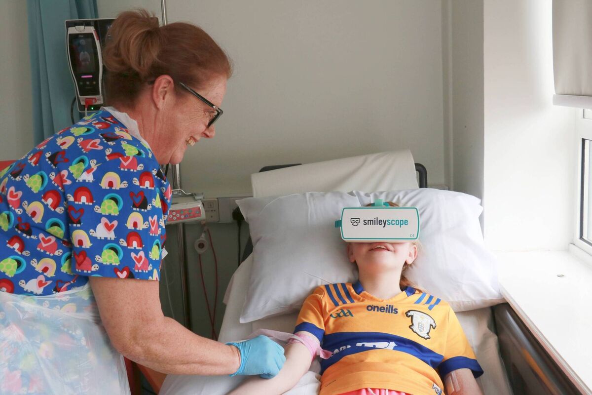 Breda Reilly, staff nurse, paediatrics, at University Hospital Galway with Éabha Sharkey from Tuam, using the Smileyscope headset.
