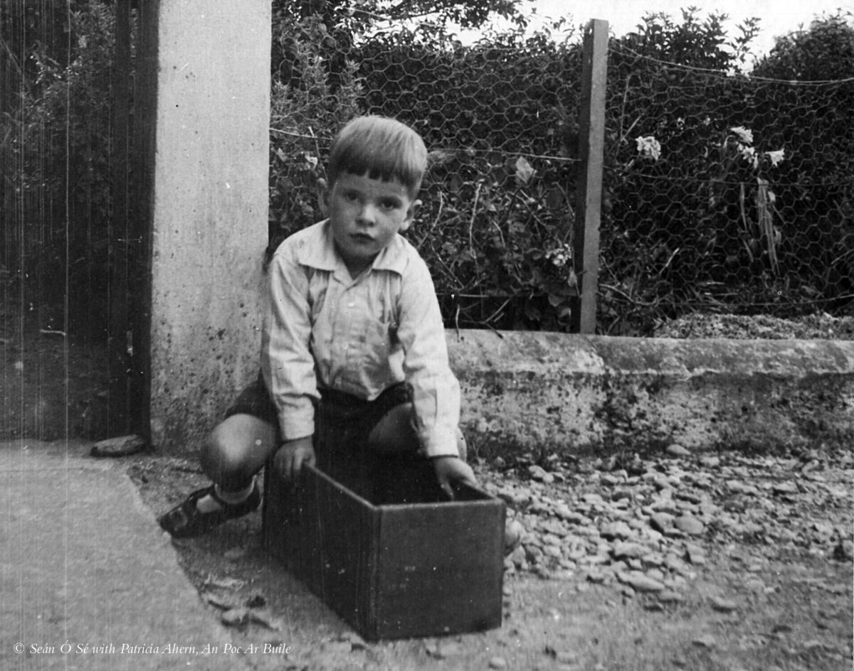 Seán, aged around six, at his father’s former home in Adrigole, west Cork, with his favourite toy – with a bit of imagination, it could be anything. taken from An Poc Ar Buile – The Life & Times of Seán Ó Sé by Seán Ó Sé with Patricia Ahern, published by The Collins Press, 2015