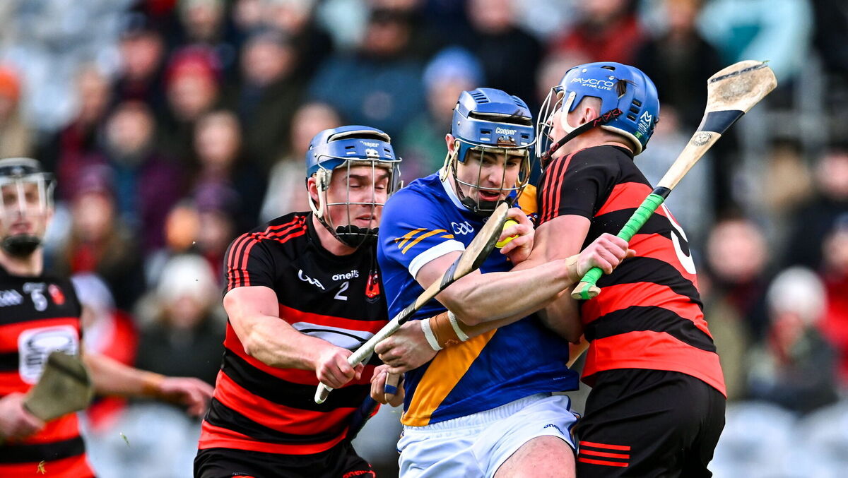 Vince Morgan of Loughrea in action against Paddy Leavey, right, and Ian O'Neill of Ballygunner. Pic: Piaras Ó Mídheach/Sportsfile