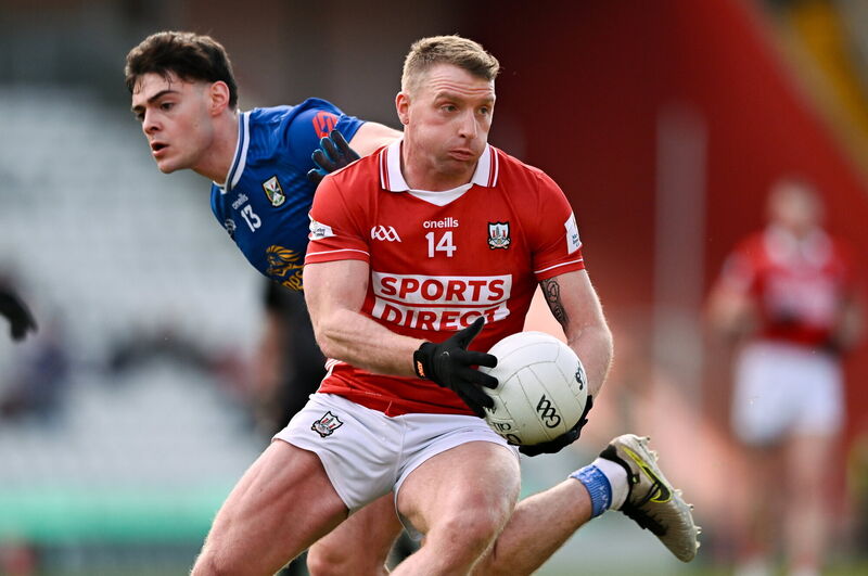 Brian Hurley of Cork in action against Oisín Brady of Cavan. Picture: Ben McShane/Sportsfile