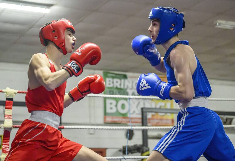 Cork Boxing: Fionn McSweeney of Elite BC and Niko Pedyk of Togher BC in action during their Junior 1 60 kg semi-final at the Cork County Boxing Championships held at the Glen Boxing Club. Picture: Doug Minihane
