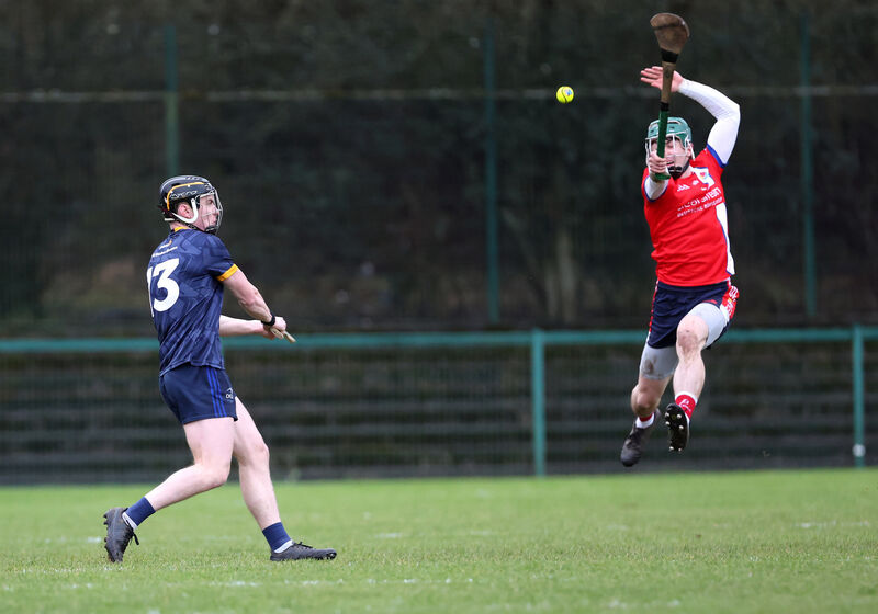  Fionn O'Connell of MTU Cork tries to a shot from Denis Walsh of DCU. Picture: Jim Coughlan