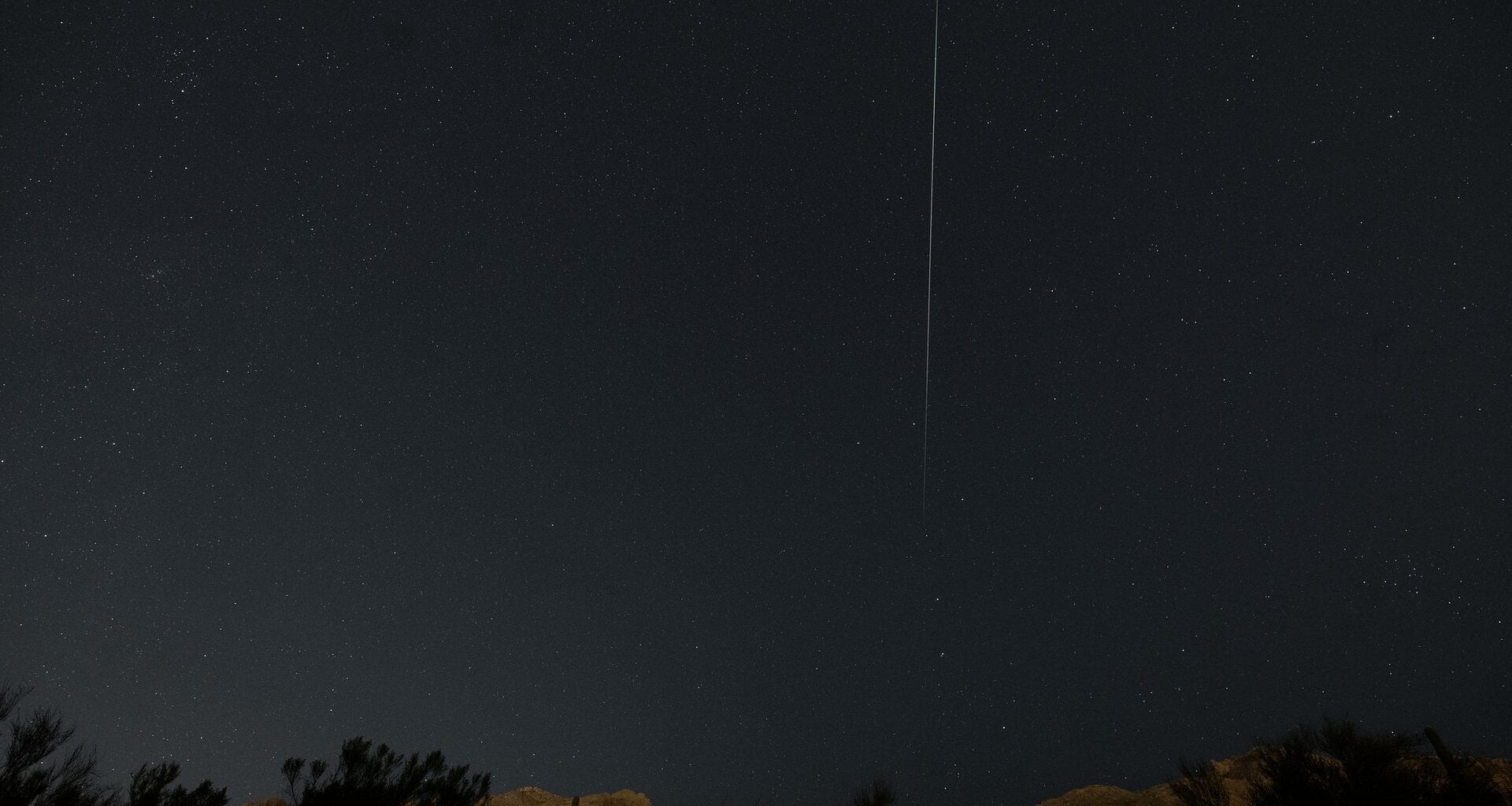 An Earth-grazing Quadrantid pierces the night sky on January 3rd, 2025. Credit: Eliot Herman.