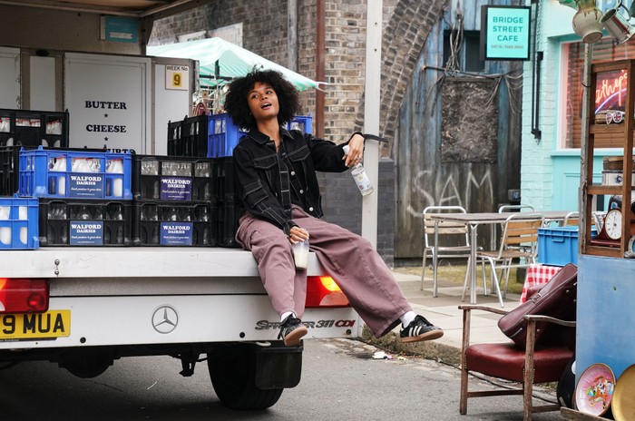 Indeyarna Donaldson-Holness sat on the bank of a milkfloat as a drunk Jasmine Fisher in EastEnders.
