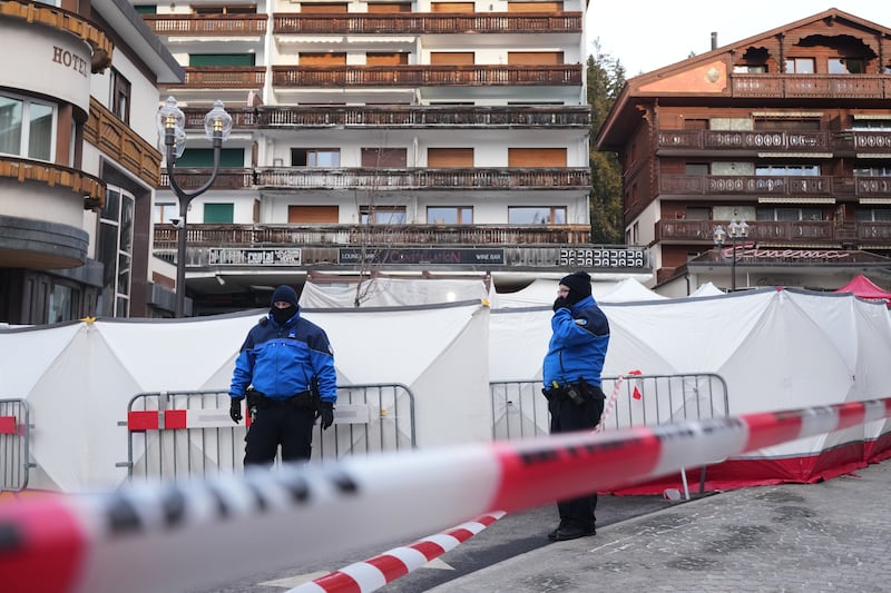 Security guards in front of the sealed-off bar. Photograph: Antonio Calanni/AP