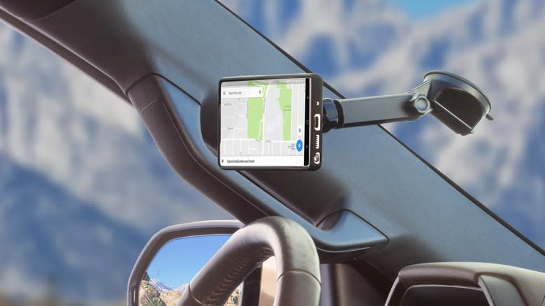 A Scosche MagicMount attached to a car windshield.