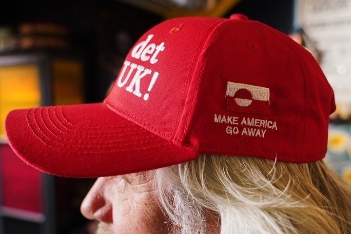 Store owner Jesper Rabe Tonnesen wears a red cap for sale that he created with the slogans "Make America go away," on the side, and on the front: "Nu det NUUK!," a twist on the Danish phrase “Nu det nok,” meaning “Now it’s enough,” substituting Nuuk, Greenland’s tiny capital.