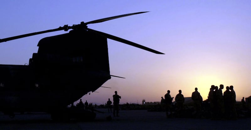US troops prepare to board a CH-47 Chinook helicopter. Photograph: Warren Zinn/Army Times-Pool/Getty