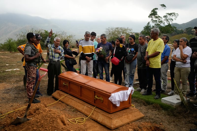 Jose Luis Gonzalez speaks during the burial of his sister Rosa Elena Gonzalez (80), who died after her apartment was hit during a US strike to capture Nicolas Maduro. Photograph: Matias Delacroix/AP