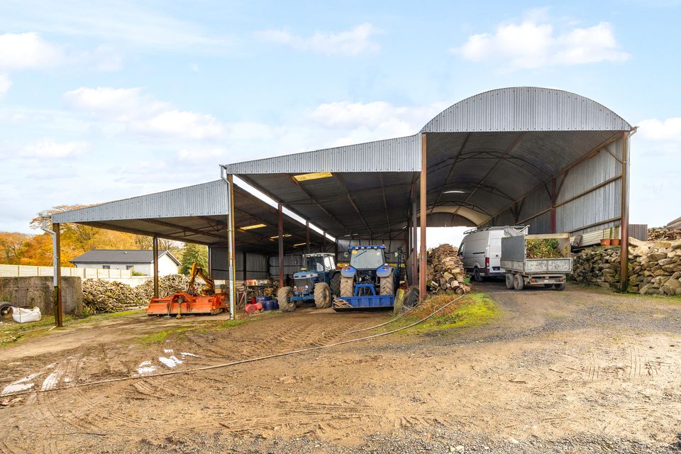 The farm buildings include a four-bay hay shed and eight lean-tos