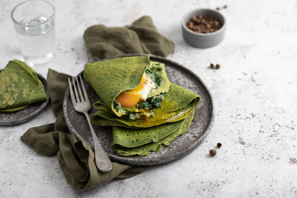 green spinach pancakes with béchamel and eggs
