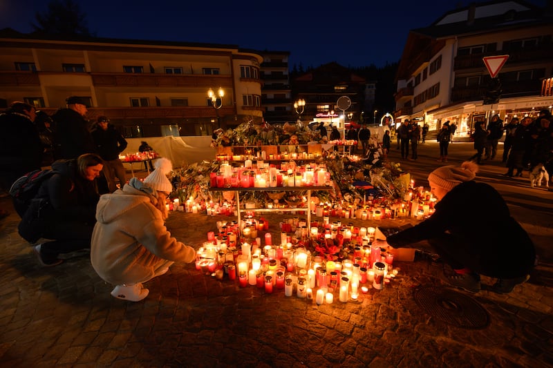 Mourners light candles as the investigation continues into the deadly New Year's Eve fire at Le Constellation bar on in Crans-Montana, Switzerland. Photograph: Getty Images