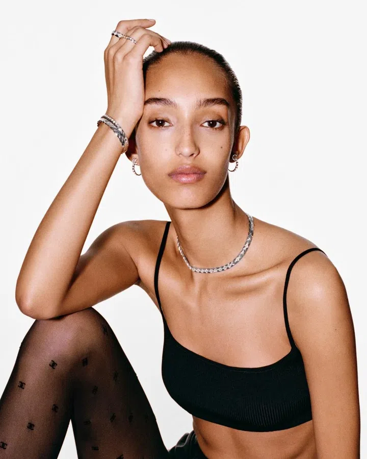 Model Mona Tougaard wearing the white gold version of the new Chanel short necklace, as well as hoop earrings, rings, and a bracelet from the same collection.