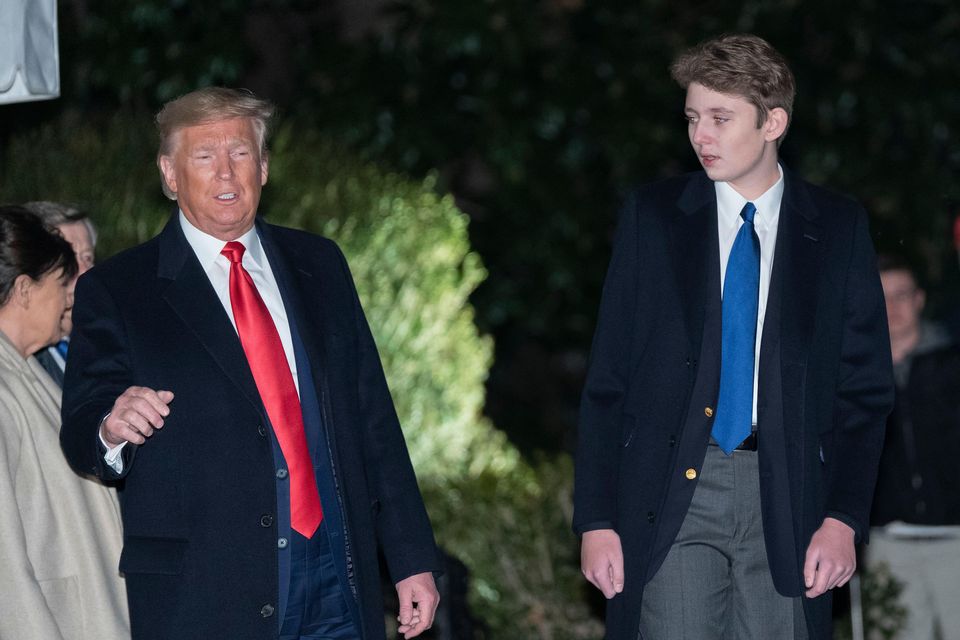 US President Donald Trump with his son Barron in 2019 (Chris Kleponis/Pool via CNP /MediaPunch/Alamy)