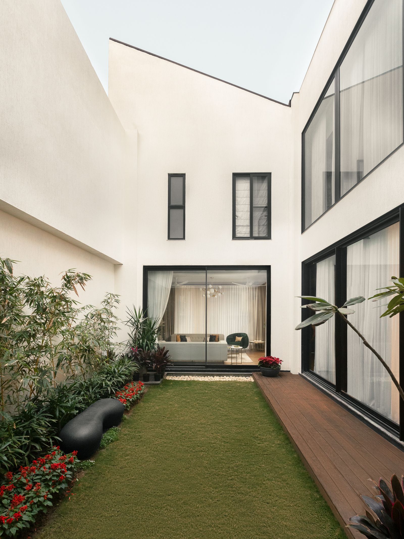 Image may contain Indoors Interior Design Floor Grass Plant Door Architecture Building House Housing and Villa