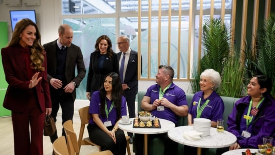 Britain's Prince William (2nd L), Prince of Wales and Catherine (L), Princess of Wales meet with volunteers of Imperial Health Charity during a visit to Charing Cross Hospital in west London on January 8, 2026, to highlight the work of NHS staff and volunteers. (Photo by Isabel Infantes / POOL / AFP)(AFP)