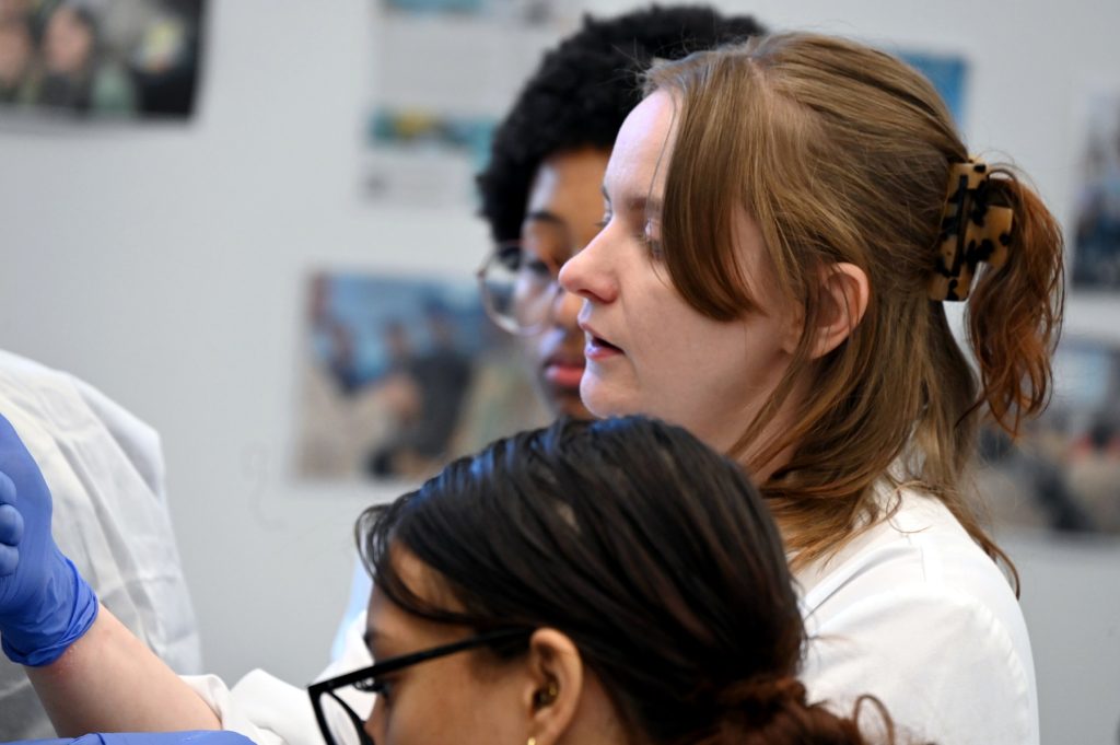 A photo of a student working in a laboratory at the Georgia Cancer Center.