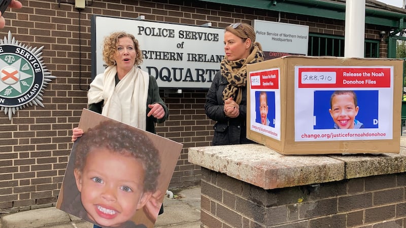 Fiona Donohoe, left, the mother of Noah Donohoe, a 14-year-old who was found dead in a storm drain in north Belfast in June 2020, delivering a petition to PSNI headquarters in Belfast. Photograph: Rebecca Black/PA