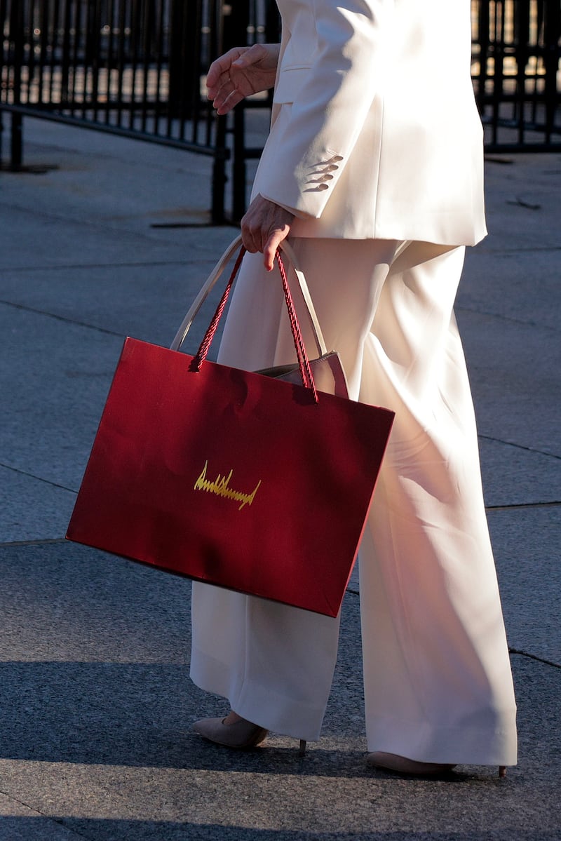 Venezuelan opposition leader and Nobel Peace Prize winner María Corina Machado carries a gift bag with President Donald Trump's signature on it outside the White House.  Photograph: Chip Somodevilla/Getty Images