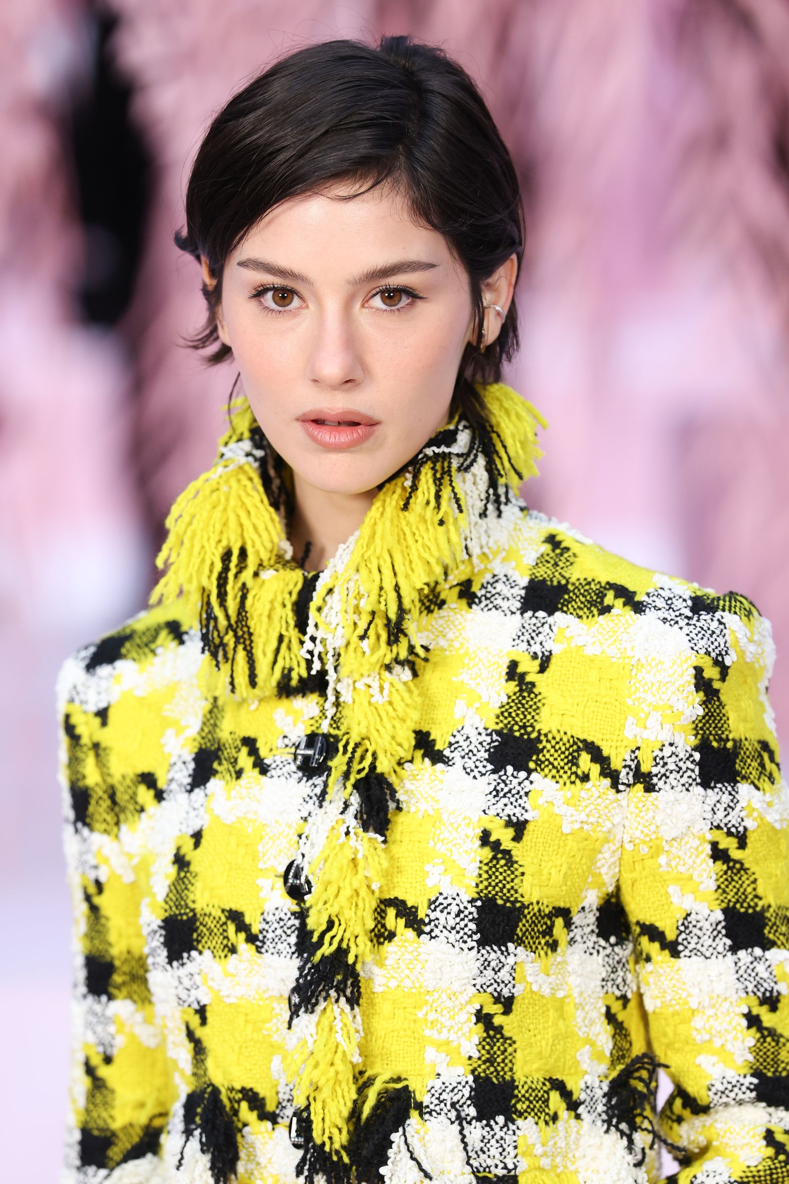 Image may contain Face Head Person Photography Portrait Black Hair Hair Adult Clothing and Coat