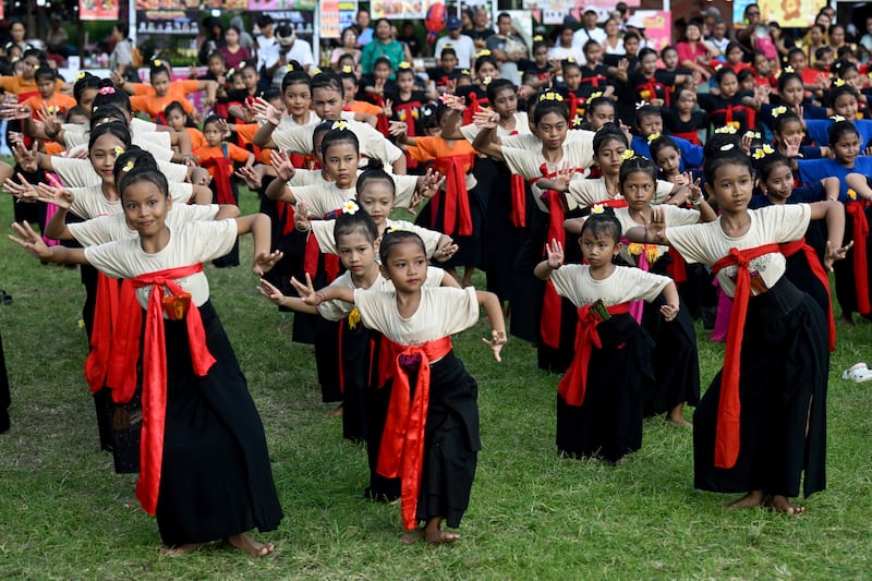 Children perform a traditional Balinese dance to release the sun of 2025, and to welcome the sun of 2026, in Denpasar, Bali. Photograph: Sonny Tumbelaka/Getty
